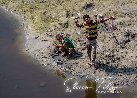 Two boys play in the river outside of the Tomb of I'timad-ud-Daulah