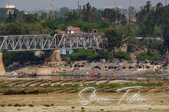 Washing and bathing in the Yamuna River near Agra Fort.