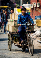 Transporting goods via bicycle.