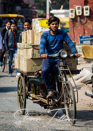 Transporting goods via bicycle.